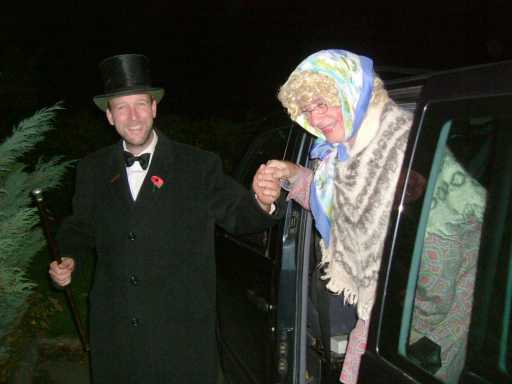 The Enterer assisting the Old Woman out of the Gang Bus (photo: Chris Martin)