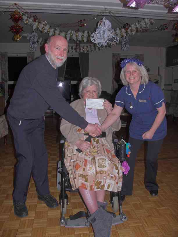 The presentation of £900 to Cotebrook House