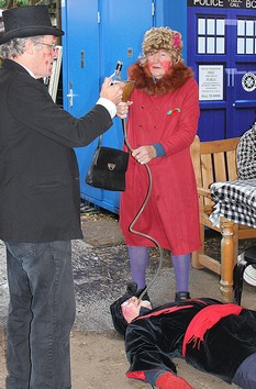 The Doctor administers the cure carefully watch by the Old Woman. (Photo: Duncan Broomhead)